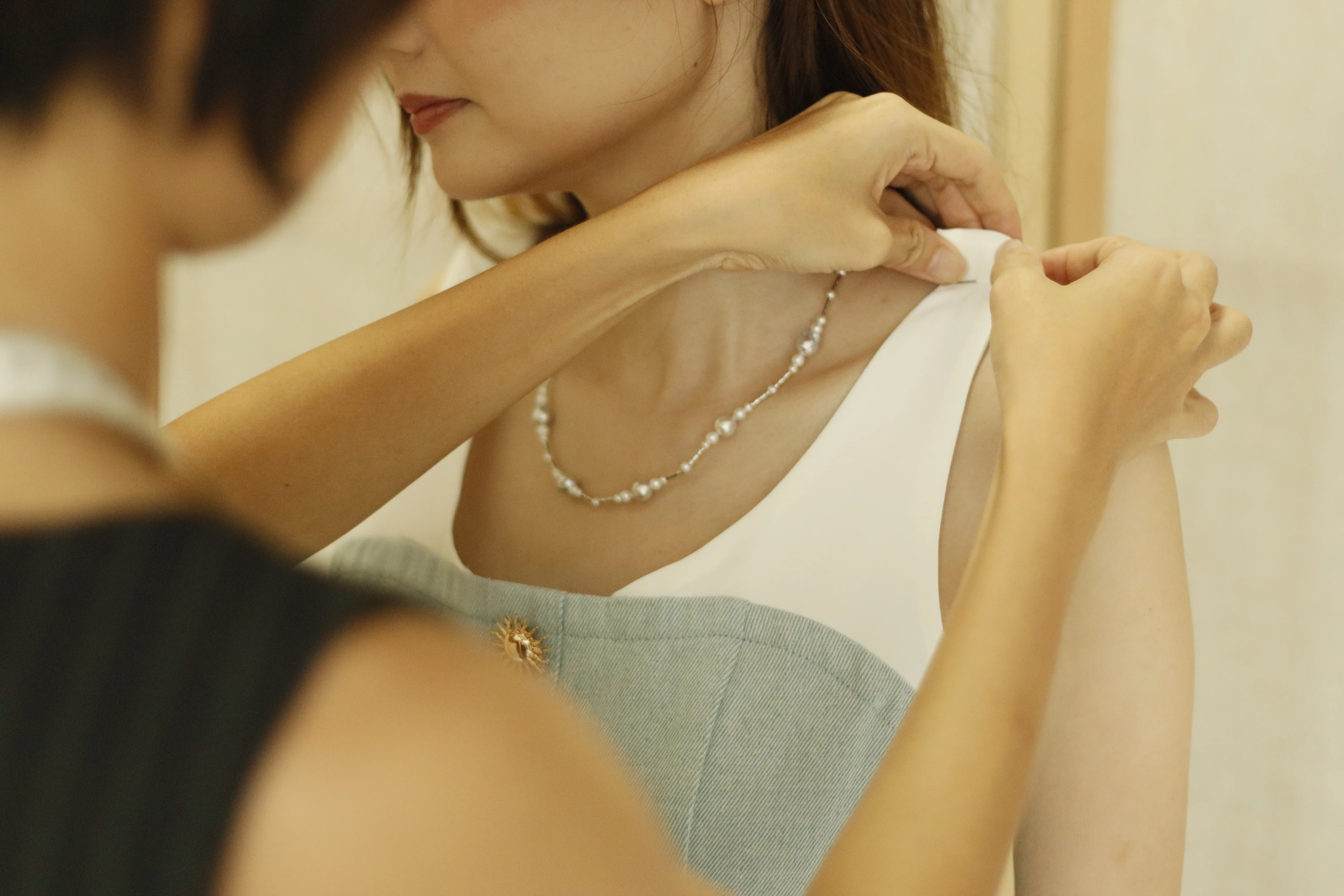 Stitch and Steam seamstress doing precise fitting